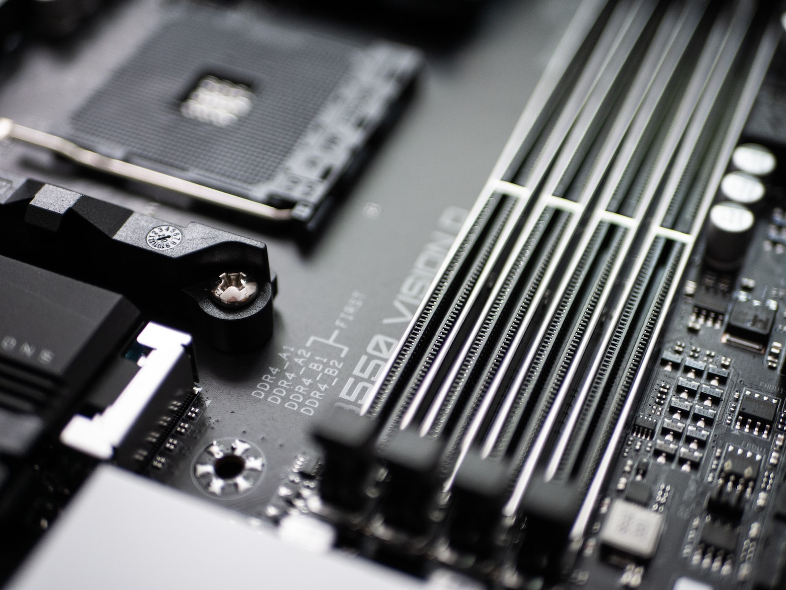 Photo by Sven Finger black and silver computer motherboard
